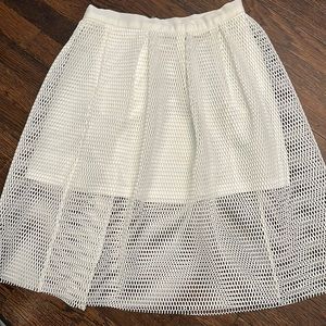 Woman’s mid length skirt with attached shorter underskirt